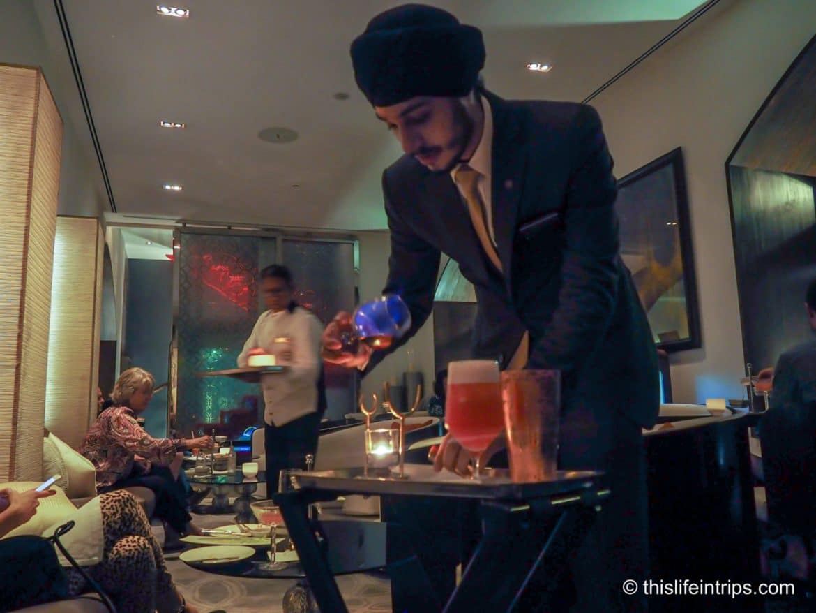 cocktail connoissuer serving us with the hotel's vintage cocktail