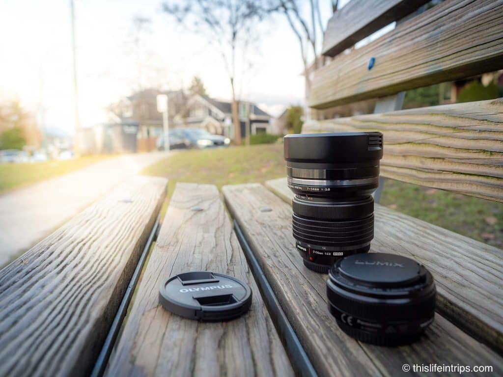 camera lenses on a park bench for a post on Tips for Scenic Photography