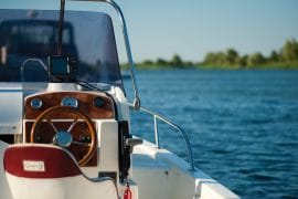white and brown boat