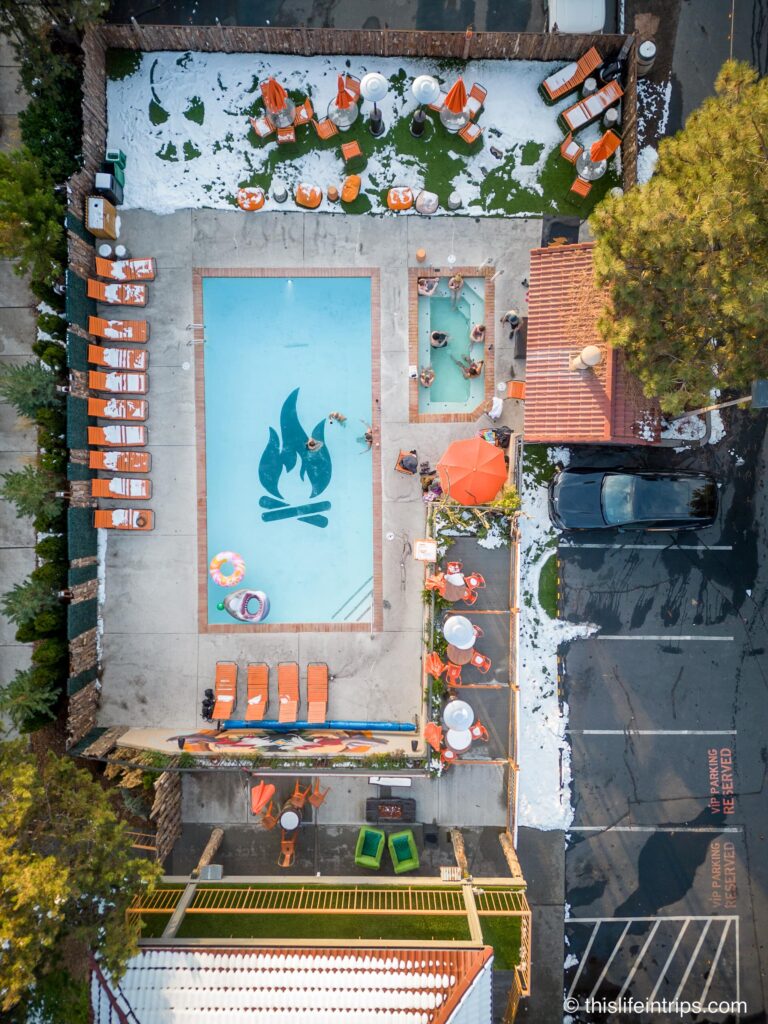 Arial shot of Campfire hotel pool with logo centered
