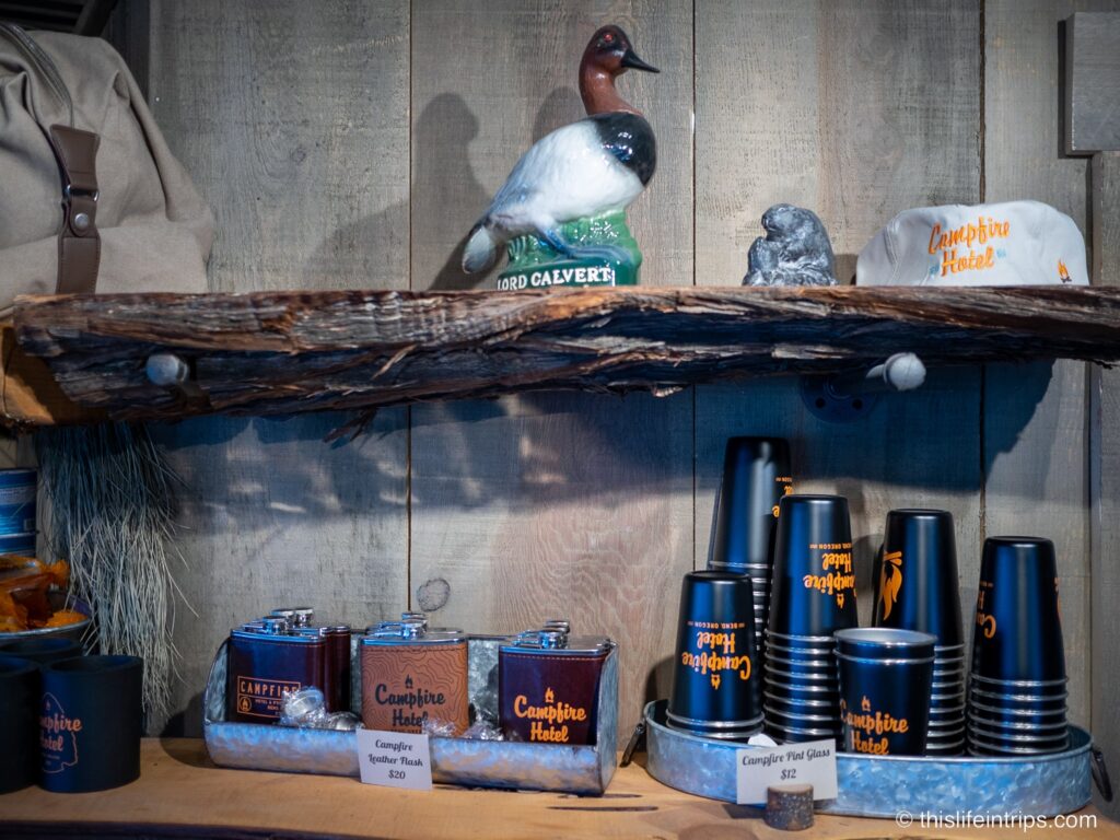 Campfire Hotel merchandise on wooden shelf