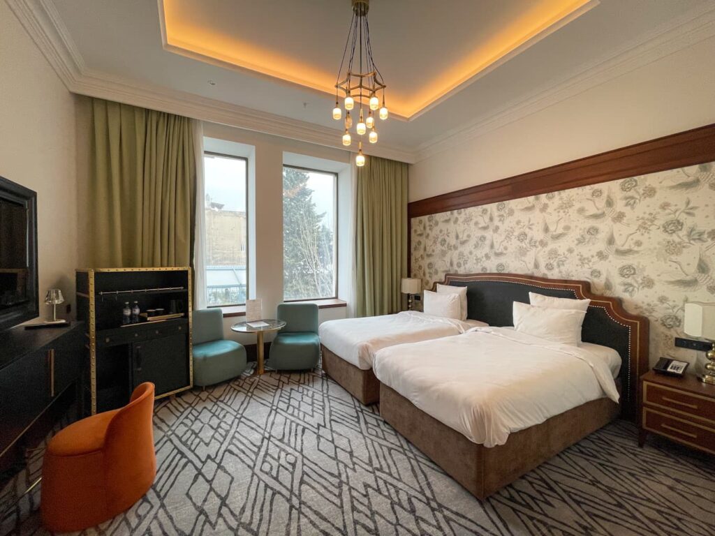 Merchant Hotel Buku deluxe guest room with twin beds