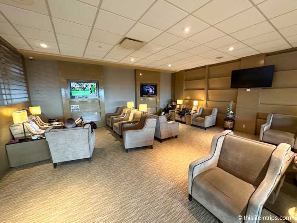 Edmonton Plaza Premium lounge seats with tv in the background