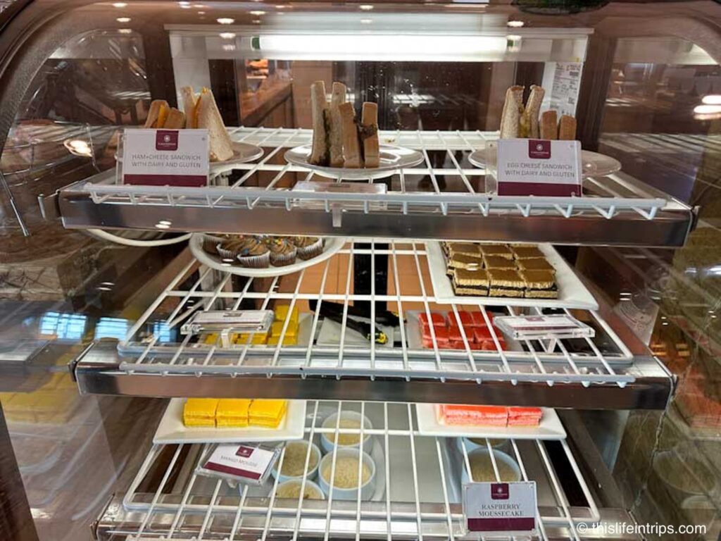 display case of sweets and sandwiches at the Edmonton Plaza Premium lounge