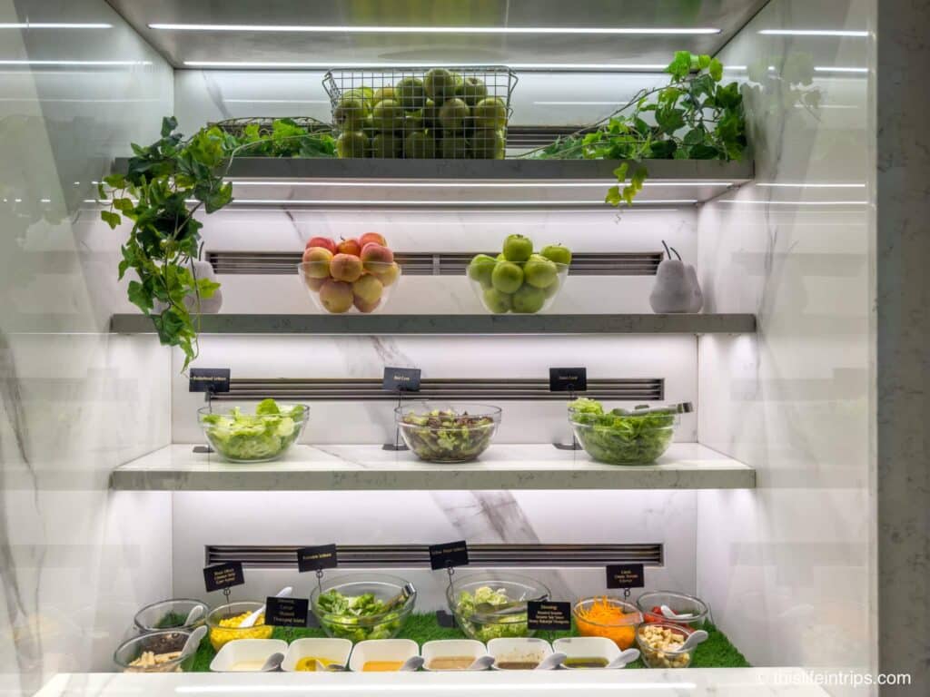 Green salad and fruit display at the SilverKris lounge