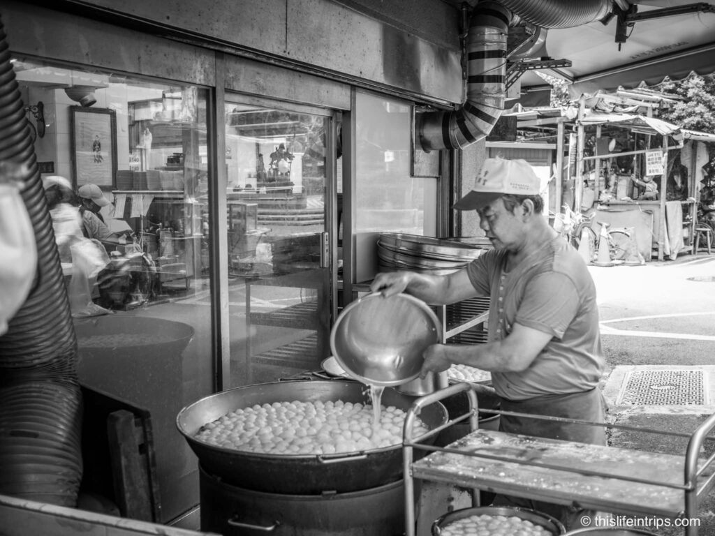 Man making fish ball soup in Taipei